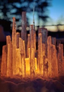 Beautiful ice art towers with light coming from the bottom. 